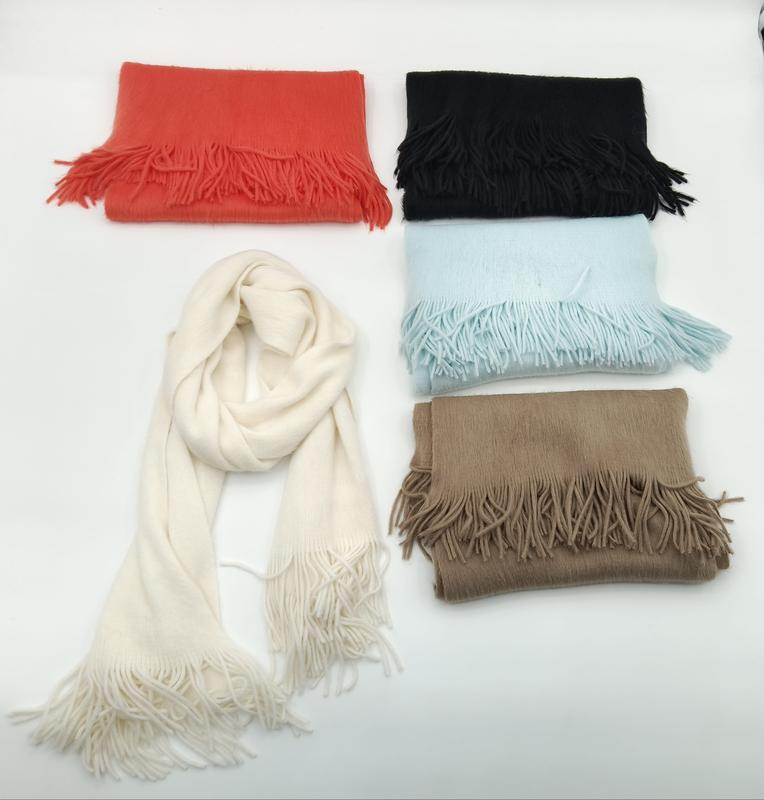 Five soft fringe scarves in cream, black, red, light blue, and tan arranged on white background, one draped open - retail buyer inquiry welcome - boutique retail bulk order
