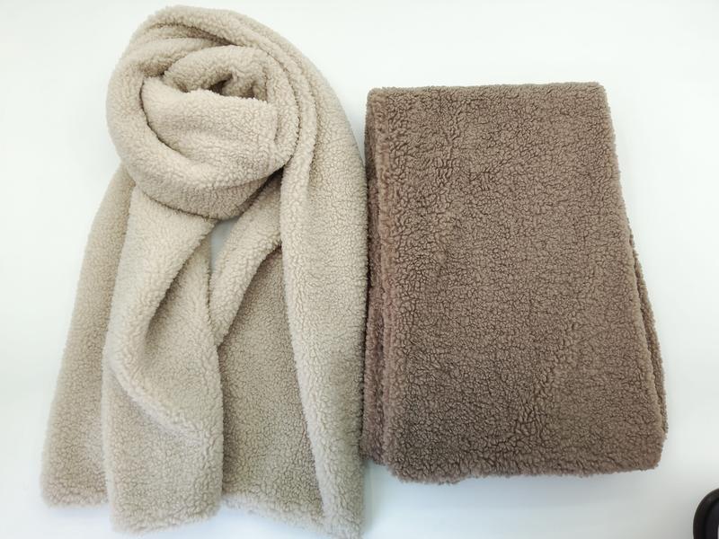 Two sherpa fleece scarves in beige and taupe colors, one draped and one folded flat, showing soft teddy bear texture - ODM OEM service available - small batch 100pcs accepted
