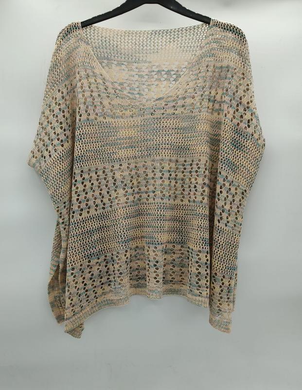 Beige and teal open-knit crochet batwing sleeve top with stripe pattern and large holes, displayed on hanger - boutique retail bulk order