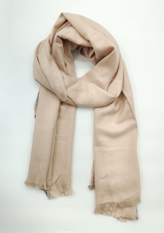 Soft beige camel-toned lightweight woven scarf loosely knotted with fringe trim ends on white background - wholesale price for Middle East buyers