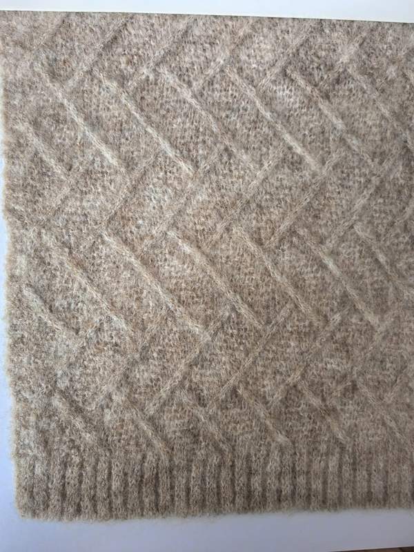 Close-up of a beige diamond lattice knit wool blend throw blanket with ribbed border edge - wholesale price for USA buyers