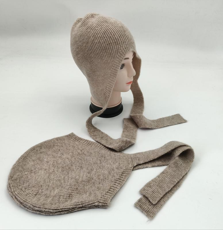 Beige ribbed knit bonnet hat with long tie straps displayed on a mannequin head alongside a flat-lay view of the same hat - low MOQ 50pcs trial order
