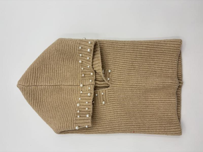 Folded beige ribbed knit infinity scarf with pearl bead trim detail, laid flat on white background - ODM OEM service available - contact for custom design quote