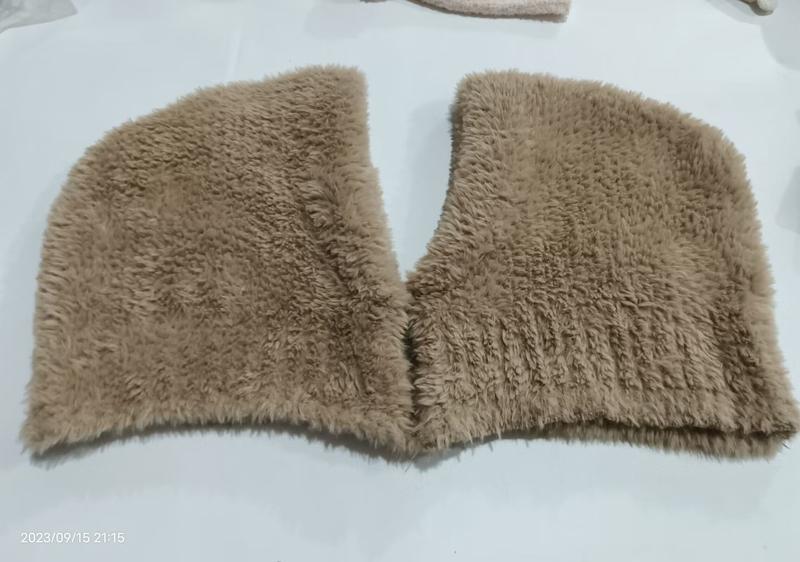 Flat lay of a beige faux fur shaggy collar wrap with V-neckline opening, placed on white surface - bulk order 20-day delivery