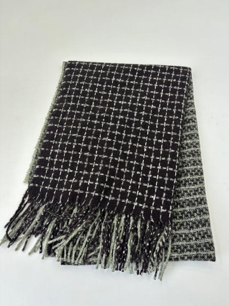 Folded black and white woven check pattern throw blanket with fringe trim, reversible houndstooth design - wholesale price for Middle East buyers