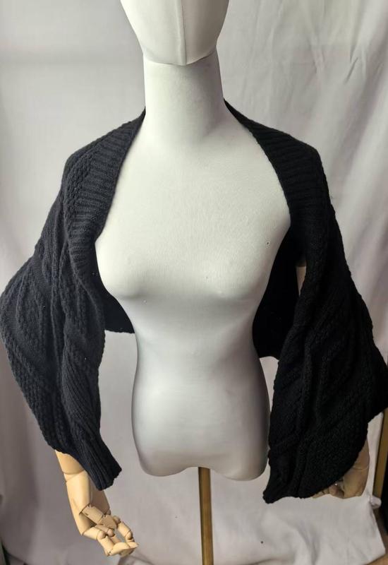 Black chunky cable knit bolero shrug cardigan with wide sleeves displayed on a dress form mannequin - custom logo label accepted