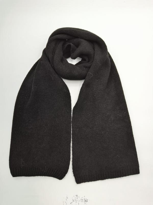 Black chunky knit winter scarf folded in loop shape with ribbed edges, laid flat on white background - boutique retail bulk order