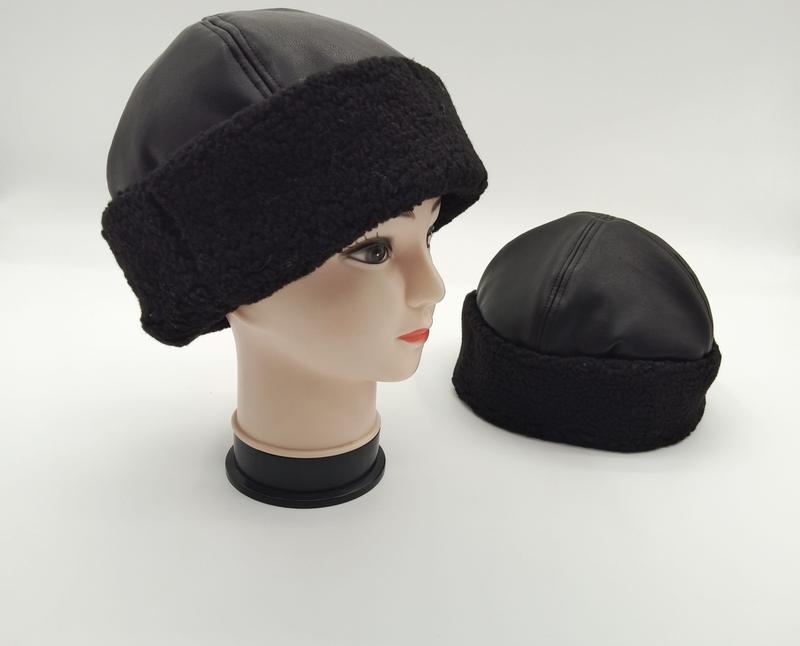 Black faux leather top beanie hat with chunky sherpa fleece cuff shown on mannequin head and standalone on white background - ask bulk pricing get discount