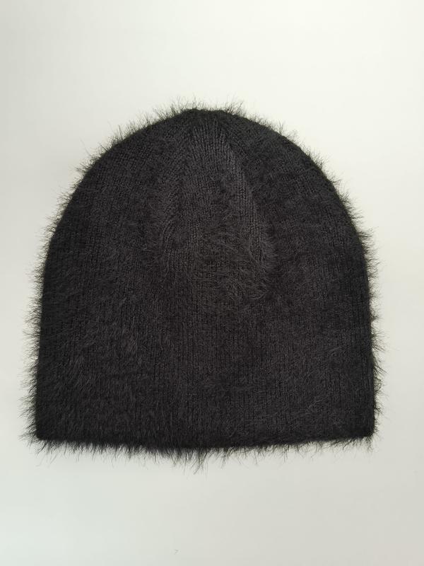 Black fuzzy knit beanie hat with fluffy mohair-style fibers and ribbed texture, laid flat on white background - express production 15 days