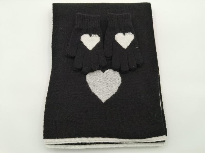 Black knitted scarf and gloves set with white heart intarsia pattern, folded flat on white background - no MOQ for stock designs