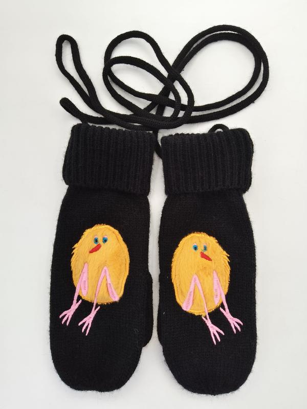 Pair of black wool knit mittens with embroidered yellow baby chick design and pink legs, connected by black neck cord - custom logo label accepted
