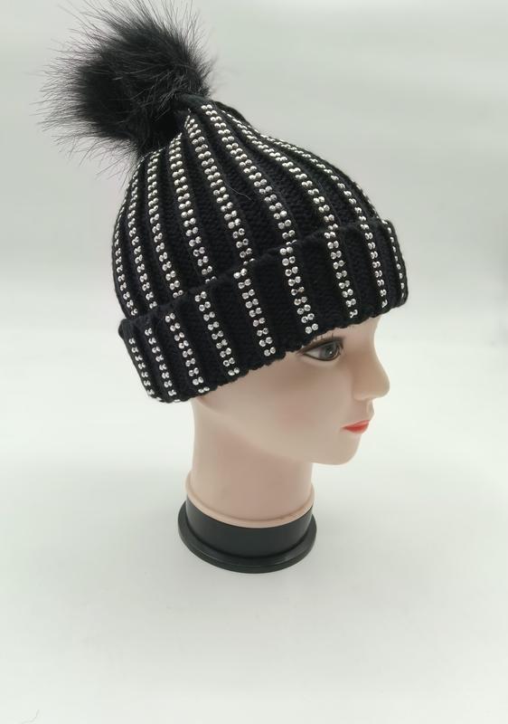 Black ribbed knit winter beanie with silver rhinestone stripes and black faux fur pom-pom on mannequin head - gift shop wholesale supplier