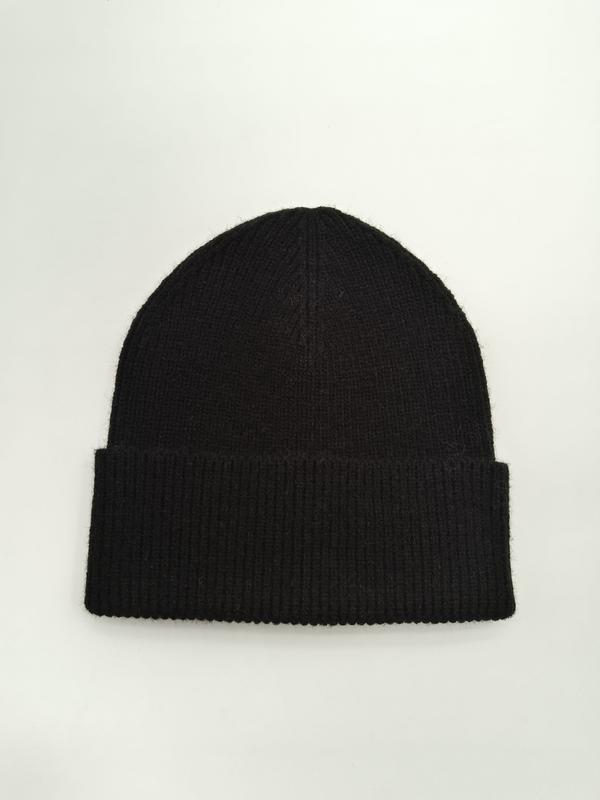 Black ribbed knit beanie with folded cuff laid flat on white background, soft wool winter hat - sample order 10pcs available