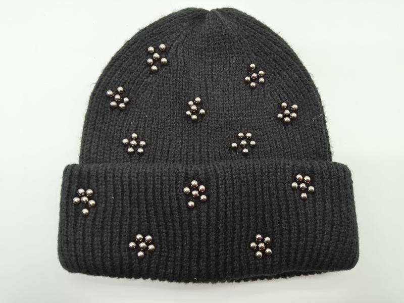 Black ribbed knit winter beanie hat adorned with scattered silver metallic bead flower clusters on folded cuff style - winter accessories wholesaler