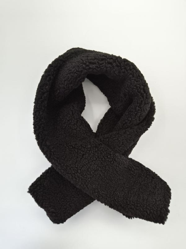 Black sherpa fleece scarf looped and crossed on white background showing thick curly teddy texture - bulk order 500+ pcs extra 8% off
