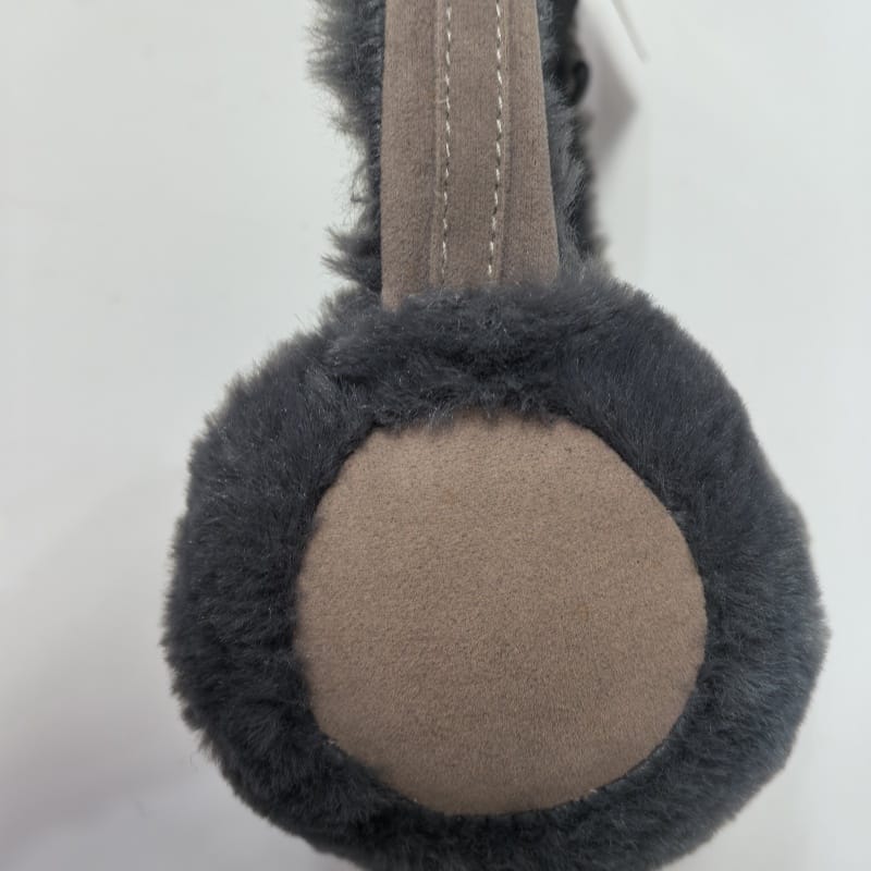 Blue fuzzy plush earmuffs shaped like a cute animal face with red pompom antennae and cream accents on white background - gift shop wholesale supplier