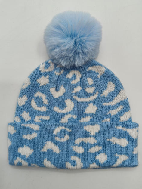Light blue and white leopard print knitted winter beanie hat with fluffy faux fur pom pom on top - BSCI + Oeko-Tex + GRS certified