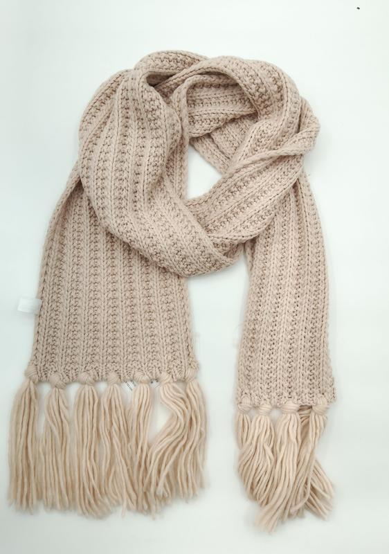 Blush beige chunky ribbed knit winter scarf with large tassel fringe ends, loosely draped on white background - custom packaging design free