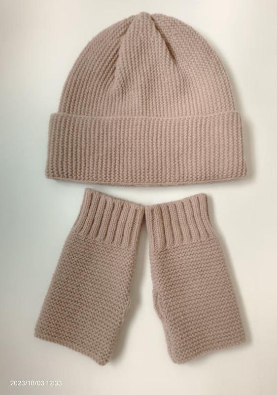 Blush pink chunky knit beanie hat and matching fingerless gloves set laid flat on white background - boutique retail bulk order