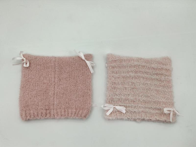 Two blush pink fuzzy knit boot cuffs with white satin ribbon bows, shown side by side on white background - tiered pricing available ask quote
