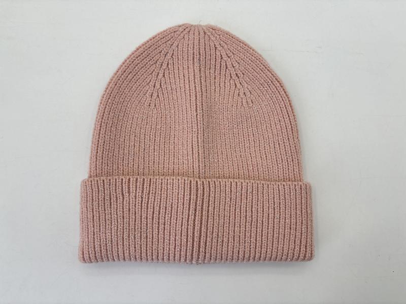 Blush pink ribbed knit cuffed beanie hat laid flat on white background, soft fine-knit winter cap - request quote reply same day