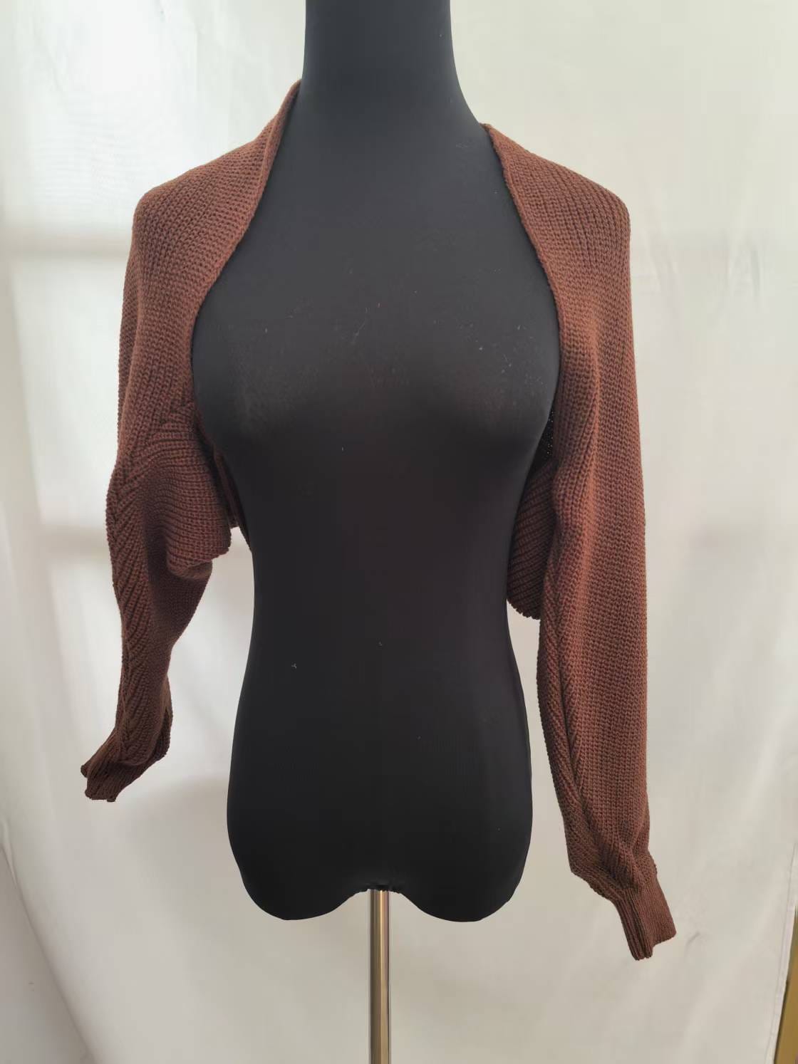 Brown chunky knit cropped bolero shrug cardigan with long sleeves displayed on a black mannequin against white background - gift shop wholesale supplier