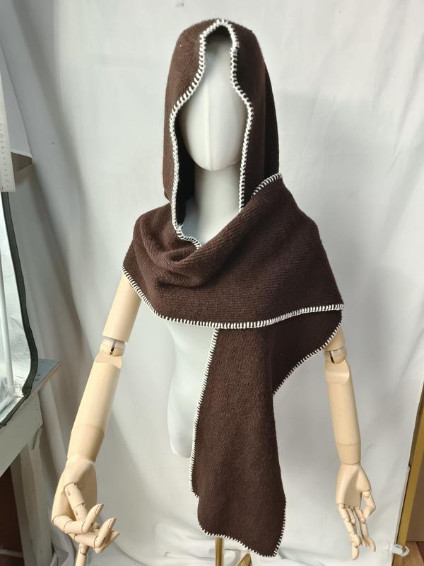 Dark brown knitted hooded scarf wrap with white blanket stitch border displayed on mannequin with wooden arms - contact for custom design quote