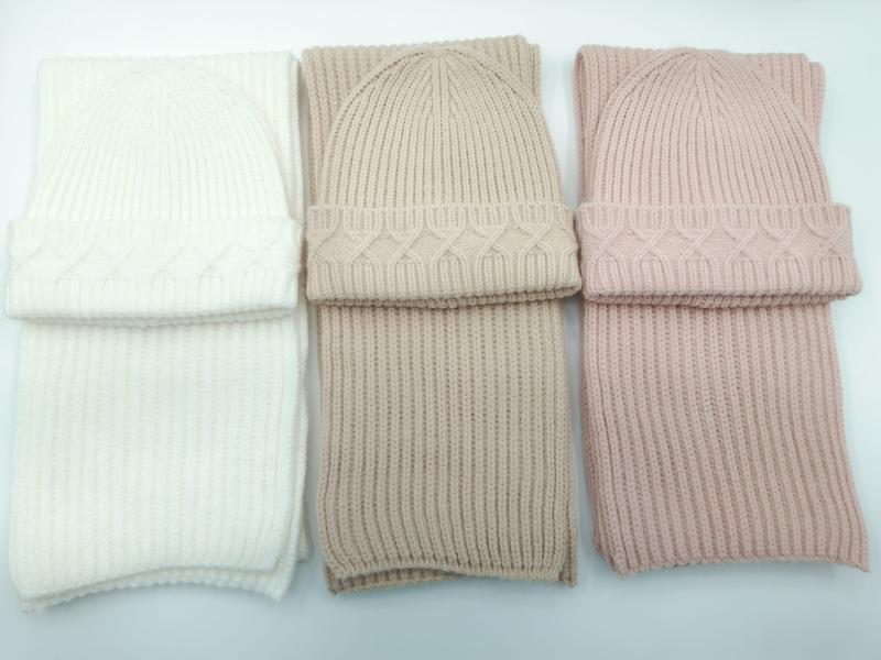 Three matching cable knit beanie hat and ribbed scarf sets in ivory, taupe, and blush pink arranged side by side on white background - Oeko-Tex Standard 100 certified