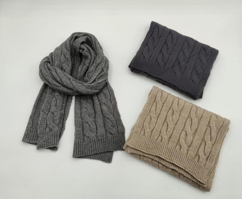 Three cable knit scarves in gray, dark charcoal, and beige folded and displayed flat on white background - air shipping 5-7 days arrival