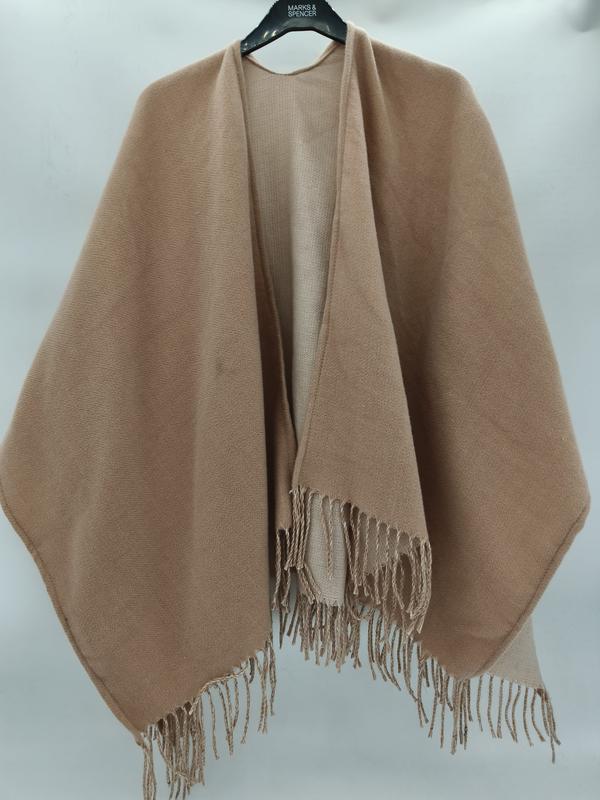 Camel beige open-front woven wrap shawl cape with twisted fringe hem displayed on a hanger - Oeko-Tex Standard 100 certified