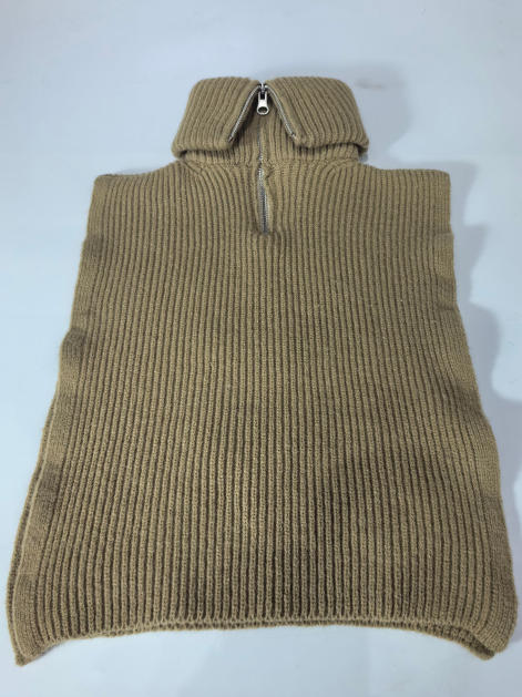 Camel beige ribbed knit sleeveless poncho sweater vest with silver half-zip turtleneck collar, laid flat on white background - email us get price list now