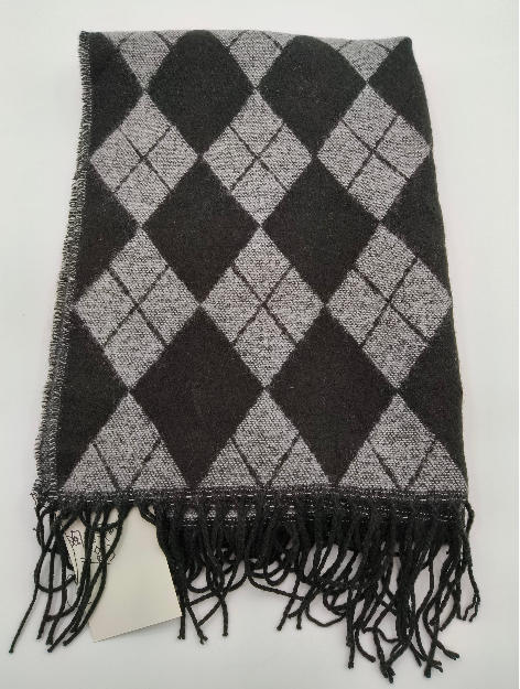 Folded charcoal and grey argyle diamond pattern knit scarf with black tassel fringe edge on white background - wholesale price for Europe buyers