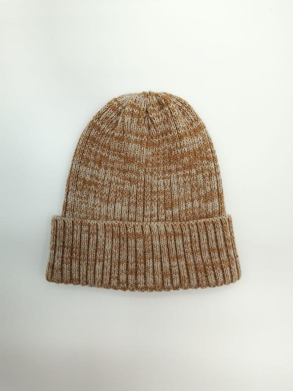 Flat lay of a chunky ribbed knit beanie hat in caramel and cream marl yarn with folded cuff on white background - email us get price list now