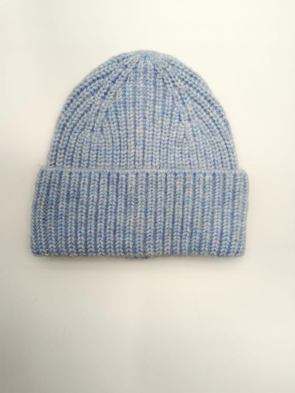 Light blue chunky ribbed knit beanie hat with folded cuff, laid flat on white background, soft marl texture - event merchandise supplier