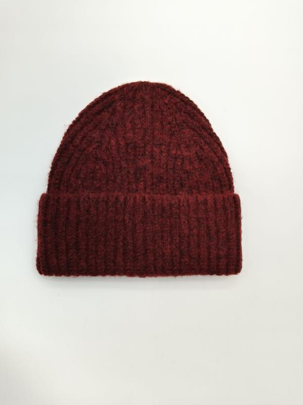 Dark burgundy chunky ribbed knit beanie hat with folded cuff, laid flat on white background - request quote reply same day
