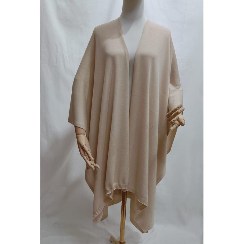 Cream beige open front oversized knit wrap poncho shawl displayed on mannequin with ribbed hem detail - retail buyer inquiry welcome - ask bulk pricing get discount