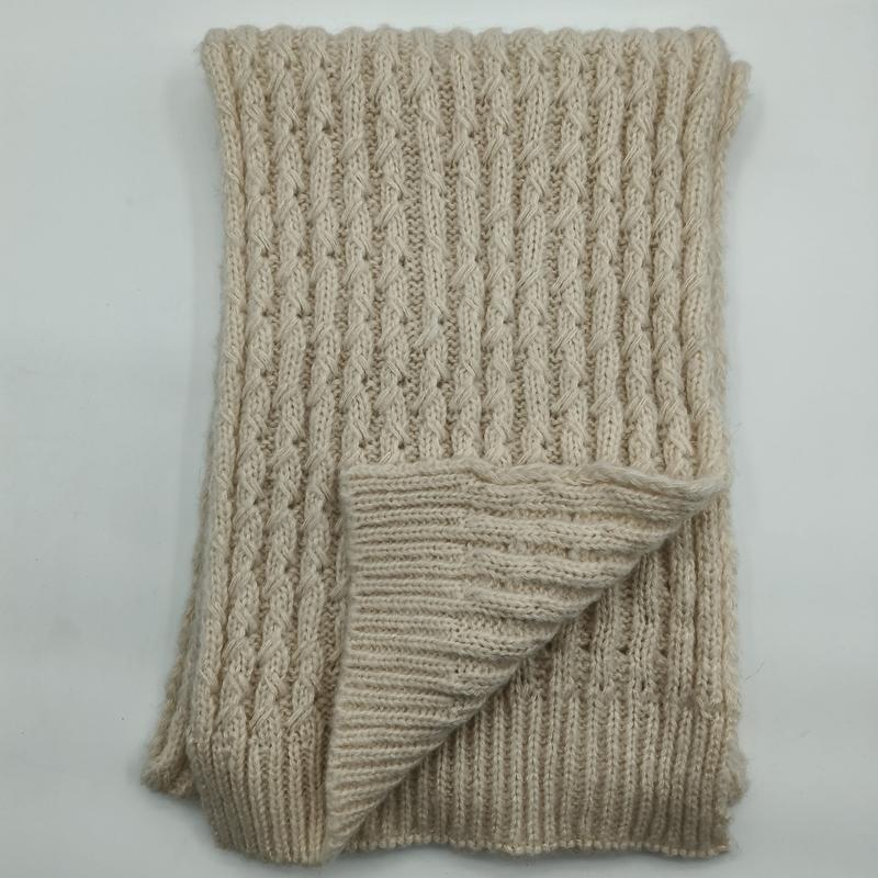 Folded cream chunky cable knit throw blanket with ribbed texture and twisted stitch pattern on white background - air shipping 5-7 days arrival