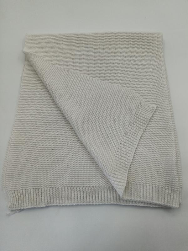 Folded cream chunky knit cotton throw blanket with ribbed edges, showing textured weave pattern on white background - express production 15 days