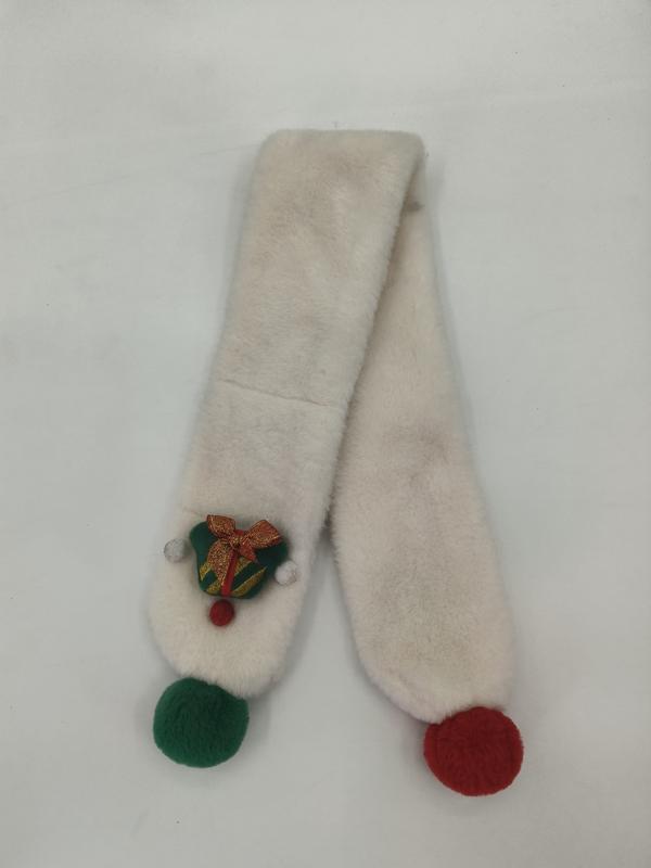 Cream faux fur scarf with green and red pom pom ends and embroidered Christmas bell brooch on white background - email us get price list now