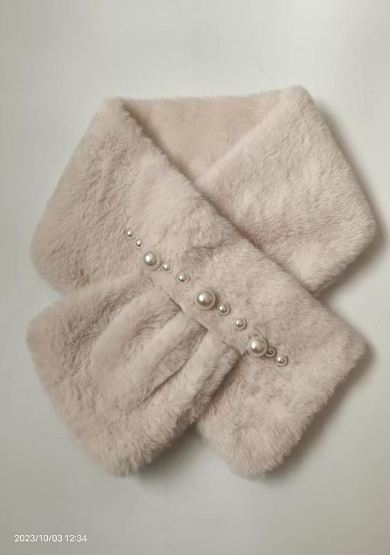 Soft cream faux fur crossover neck scarf with pearl bead embellishments arranged diagonally, folded flat on white background - WhatsApp quote in 2 hours