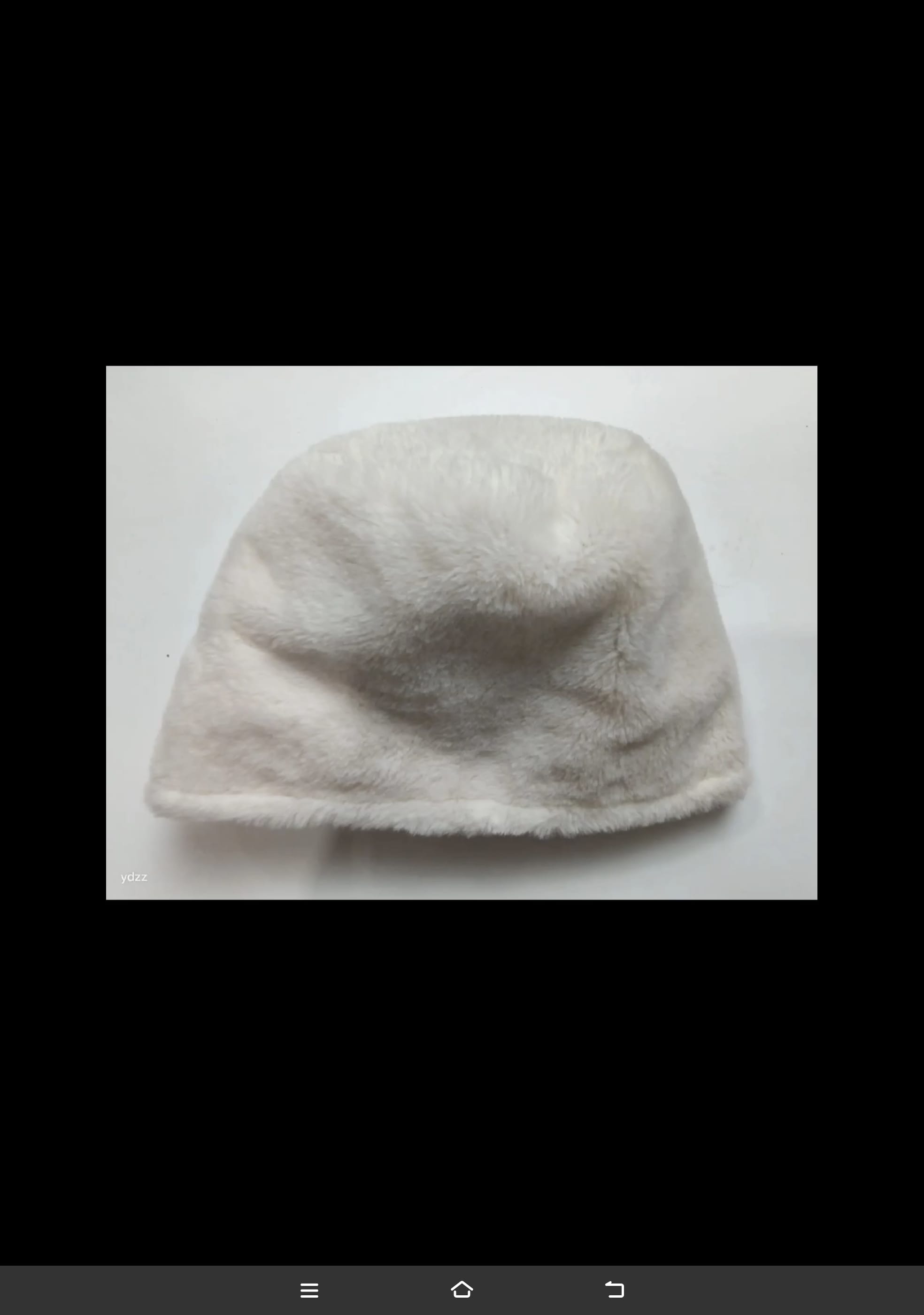Cream white faux fur plush bucket hat laid flat on white surface, soft fluffy texture winter accessory - tiered pricing available ask quote