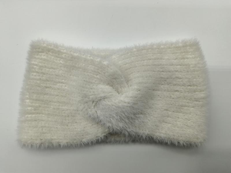 Cream white fuzzy ribbed knit headband with center twist knot detail, laid flat on white background - BSCI + Oeko-Tex + GRS certified