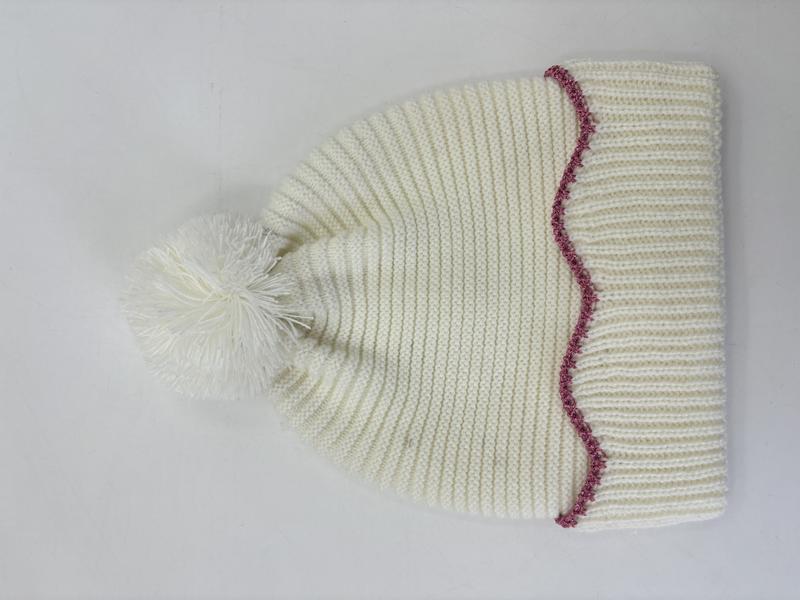 Cream chunky ribbed knit winter beanie hat with fluffy pom-pom top and decorative pink zigzag stitch trim at brim - ask bulk pricing get discount