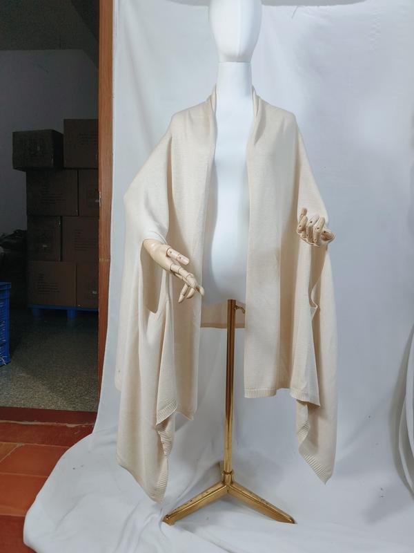 Cream ivory fine knit oversized wrap shawl displayed on mannequin, open front with ribbed hem trim and draped silhouette - email us get price list now