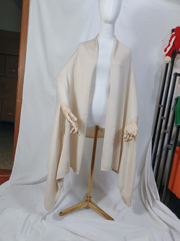 Cream ivory fine knit open-front wrap shawl poncho draped on mannequin with ribbed hem trim - event merchandise supplier