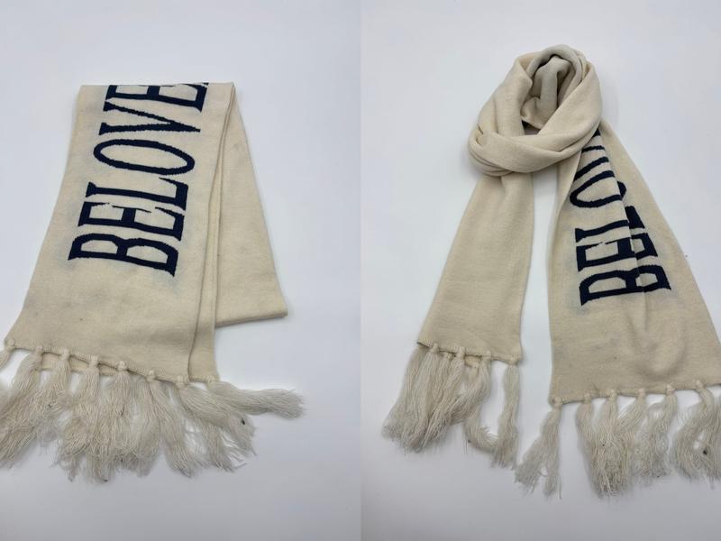 Cream knit scarf with navy blue BELOVED intarsia lettering and long fringe tassel ends, shown flat and wrapped - air shipping 5-7 days arrival
