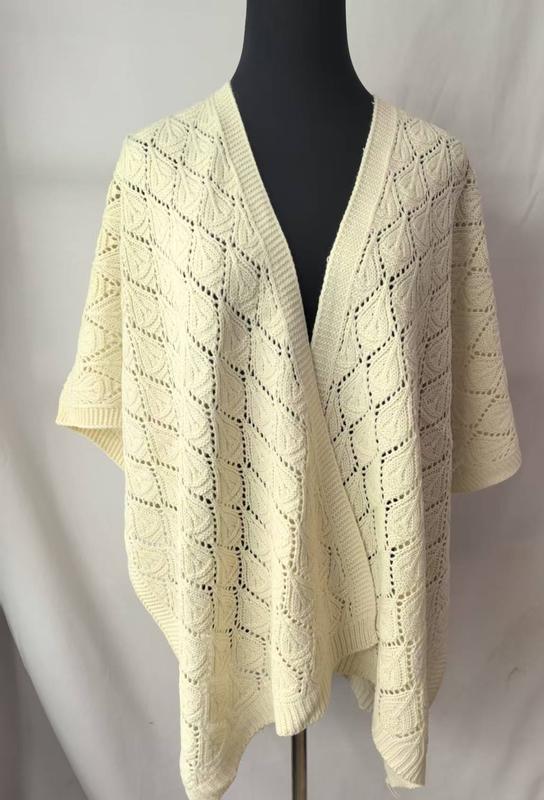 Cream ivory open-knit lace poncho wrap cardigan with diamond leaf pattern displayed on black mannequin - ODM OEM service available - wholesale price for Middle East buyers