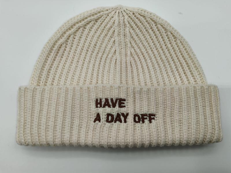 Cream chunky ribbed knit beanie hat with brown embroidered text 'Have A Day Off' on folded cuff - BSCI audit passed supplier