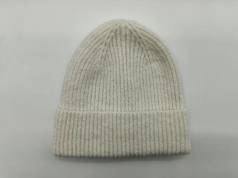 Cream off-white ribbed knit winter beanie hat with folded cuff displayed flat on light grey background - free sample within 7 days