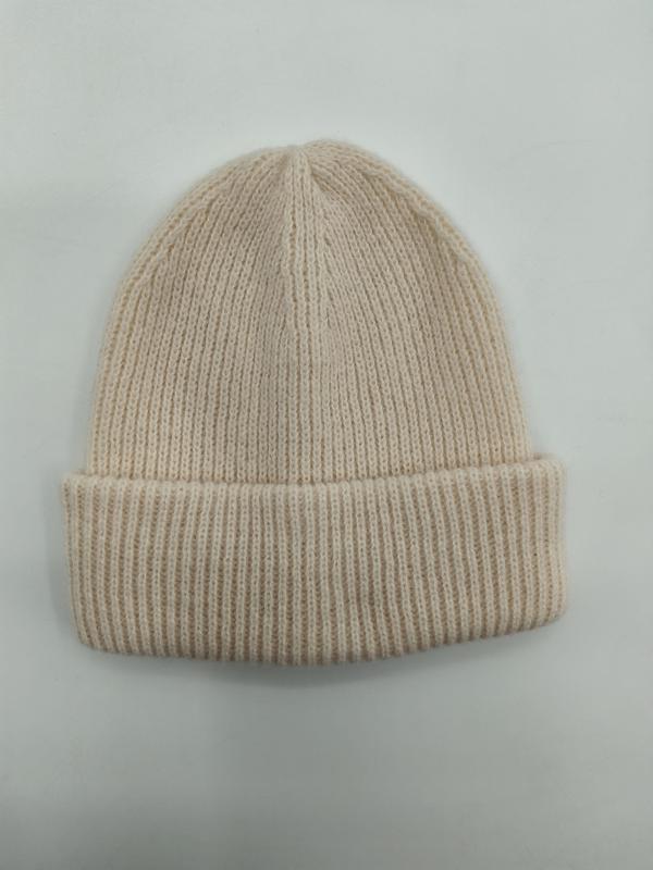 Cream off-white ribbed knit cuffed beanie hat laid flat on white background, soft wool blend winter hat - EU REACH compliant material